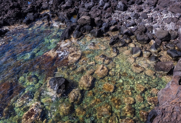 View of the scenic lava rock cliff in the Linosa island