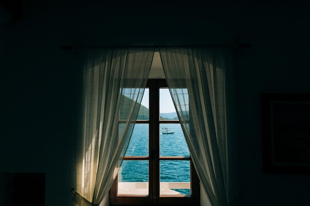 View of sea through window