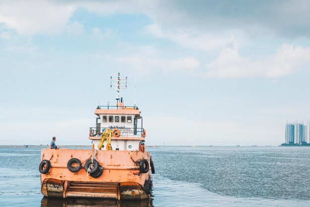 View of ship in sea against sky