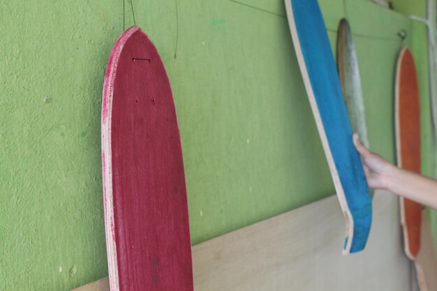 Photo view of skateboards hanging in workshop