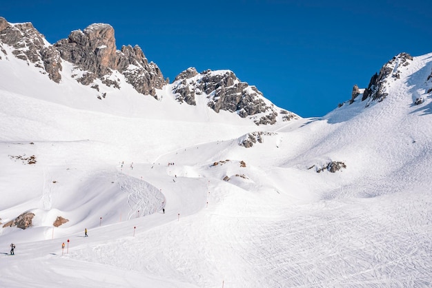 View of ski trails on snow covered mountain range