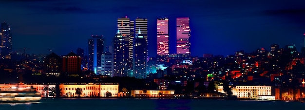 View on skyscrapers and Dolmabahce palace in european district of Istanbul at night, Turkey