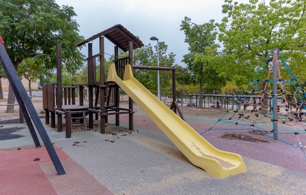 View of slide in empty park on an autumn day