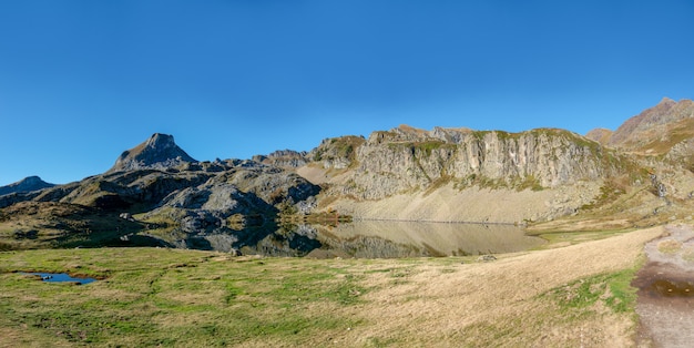 View of small lake in Pyrenees mountain