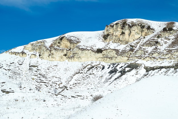 View of a small snowcovered chalk mountain