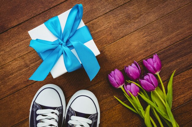 View of sneakers and blue gift