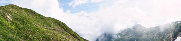 View of snow capped mountains and cloudy sky in Sochi