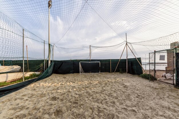 Photo view of soccer field against cloudy sky