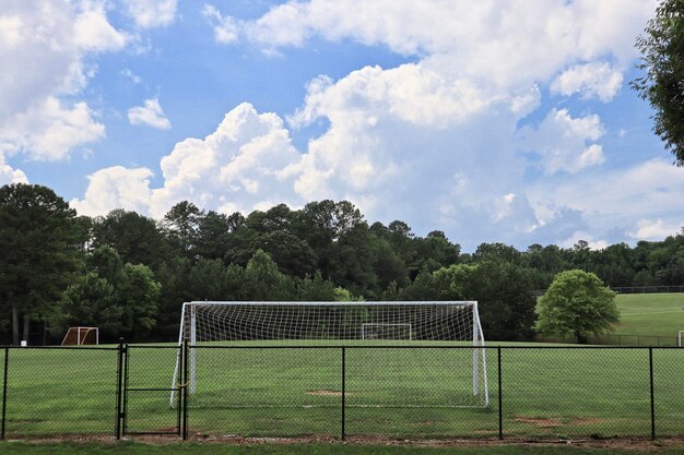 View of soccer field against cloudy sky