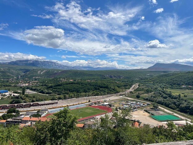 A view of a soccer field from a mountain