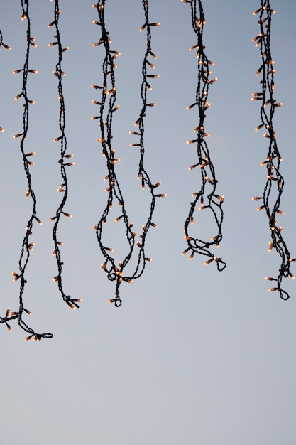 View of some christmas lights hanging aligned side by side.