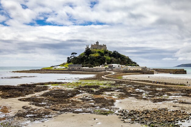 View of St Michaels Mount near Marazion Cornwall on May 11, 2021. Unidentified people