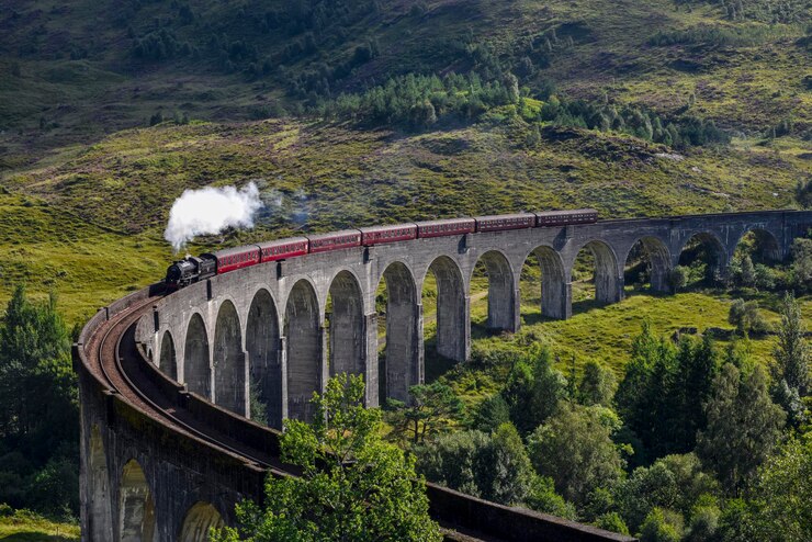 Photo view of steam train on bridge