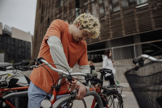 View of stylish man looking at bike