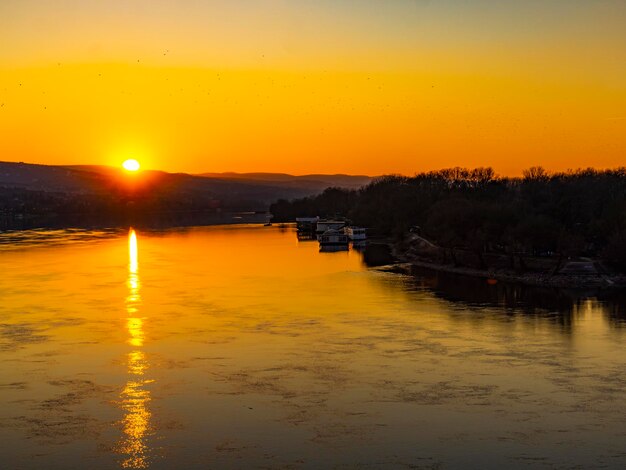 View at sunset over calm danube river in novi sad serbia