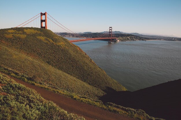 Photo view of suspension bridge over river