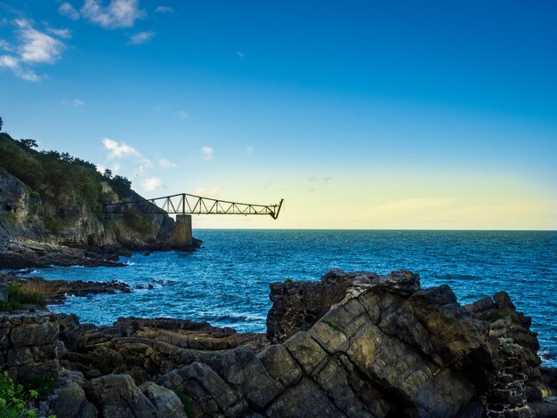 View of suspension bridge over sea