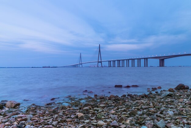 View of suspension bridge over sea