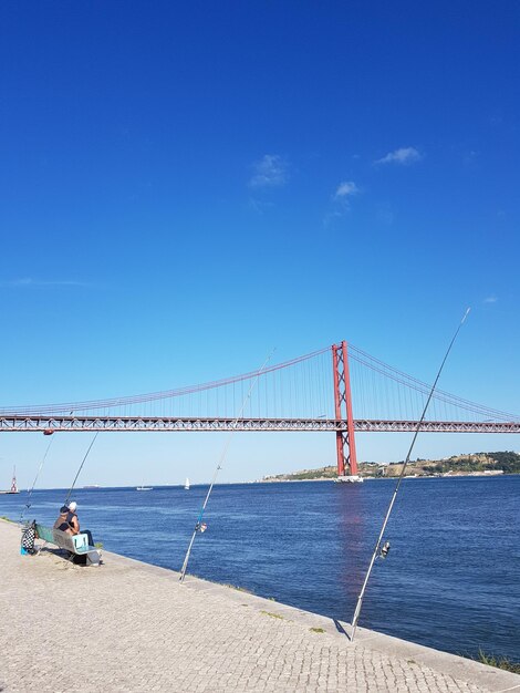 View of suspension bridge over sea