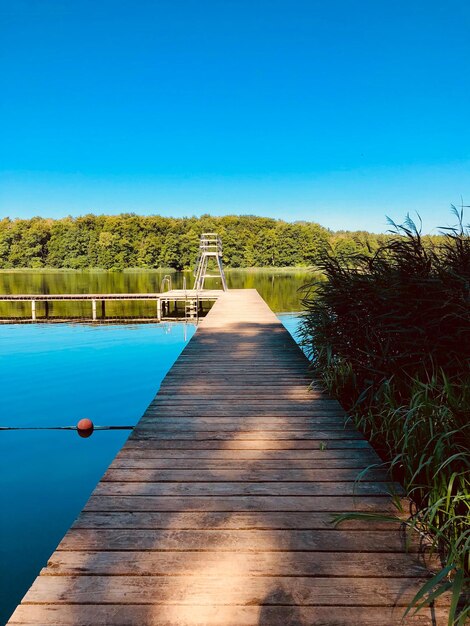 View of swimming pool against clear blue sky