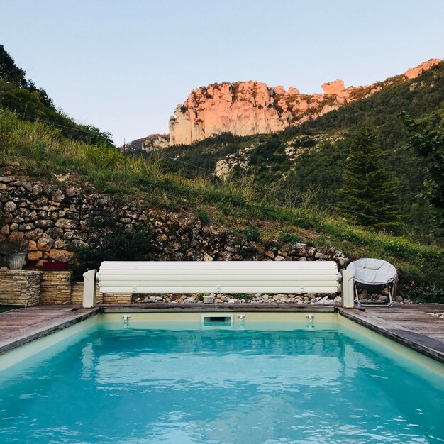 View of swimming pool against mountain