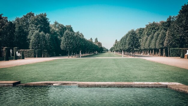 View of swimming pool in park against clear sky