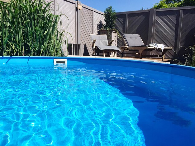 View of swimming pool in yard