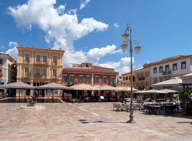 View of syntagma square of the old town of nafplion peloponnese greece with tourists