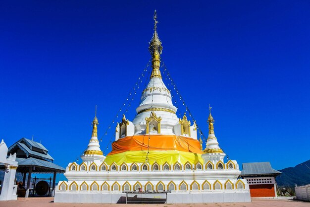 View of temple against building