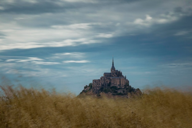 view of temple building against cloudy sky