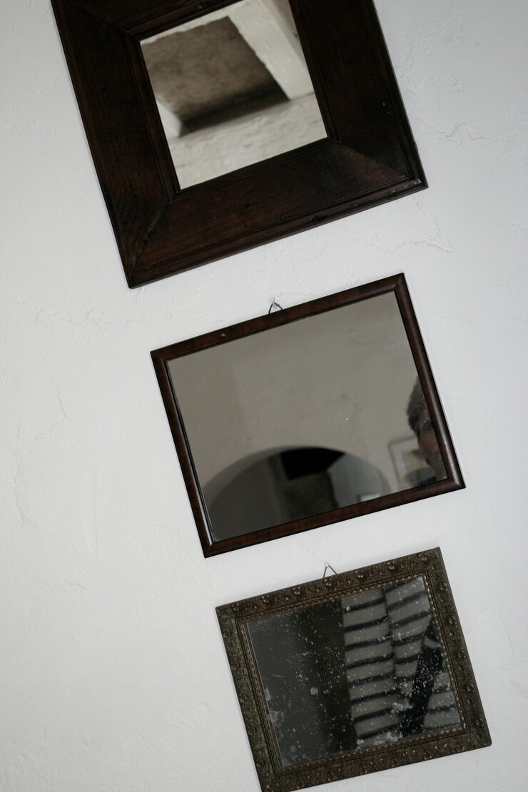 Photo view of three indoor mirrors