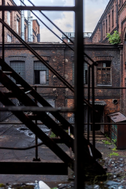 View through the stairs to the building of the old factory