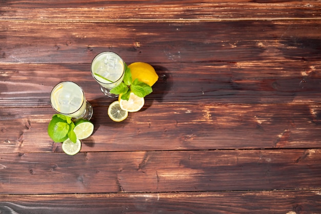 View of the top of a lemon glass on a wooden floor