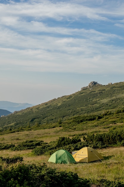 View of tourist tents in mountains