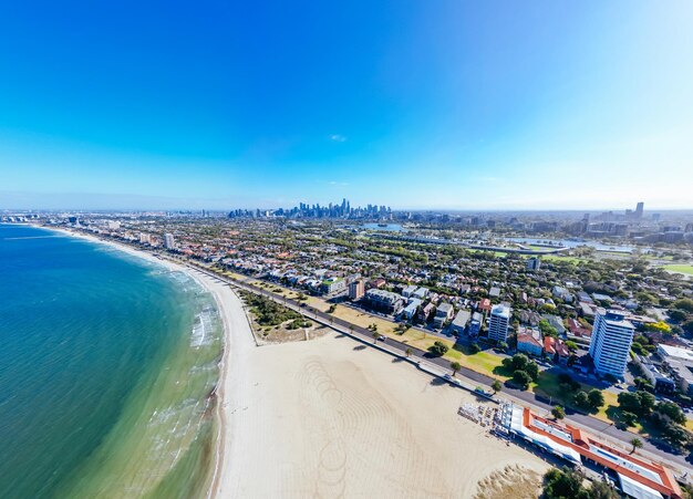 View towards melbourne skyline on a warm summer's morning from st kilda west beach in australia