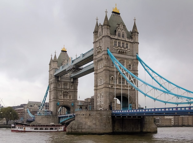 View Of Tower Bridge In London, England With Cloudy Grey Sky