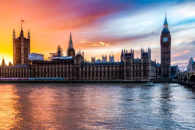 View of tower in city at sunset