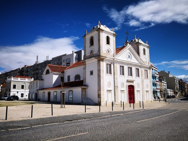 View of town against cloudy sky