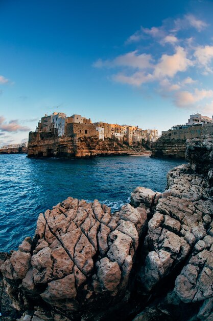 View of town by sea against sky