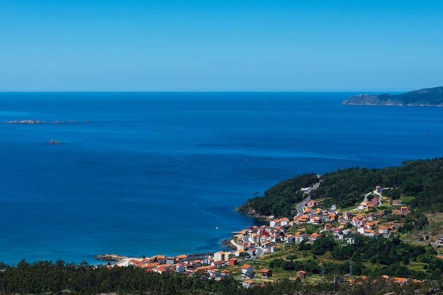 View of the town of o pindo and bridge of ezaro galicia spain