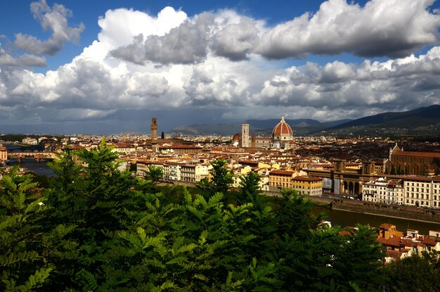 View of townscape against cloudy sky