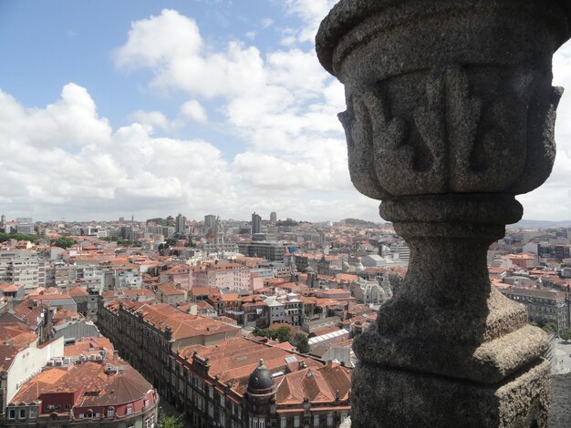 View of townscape against cloudy sky