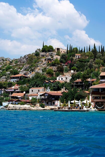 View of townscape by sea against sky