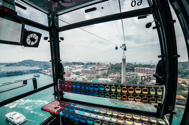 View for Turquoise Sea with Ship and Island from Cable Car to Sentosa, Singapore