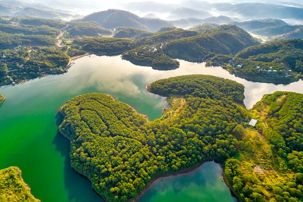 View Tuyen Lam lake seen from above with blue water and paradise islands below give this place