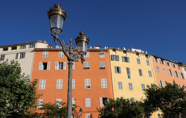 A view of typical Bastia lamppost and colorful houses Corsica island France