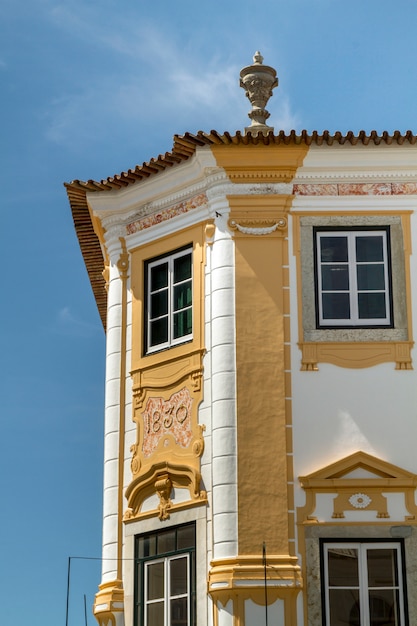 Photo view of a typical historical building from european cities, located in evora, portugal.