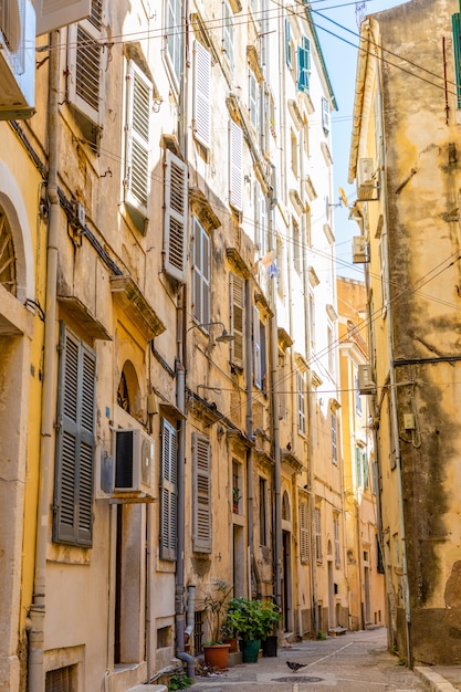 View of typical narrow street of an old town of Corfu, Greece