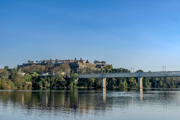 View of the Valenca do Minho fortress reflecting in the river and the International Iron Bridge