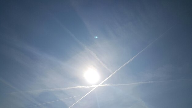 Photo view of vapor trails on sky